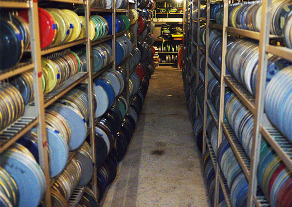 a basement filled with racks of film canisters