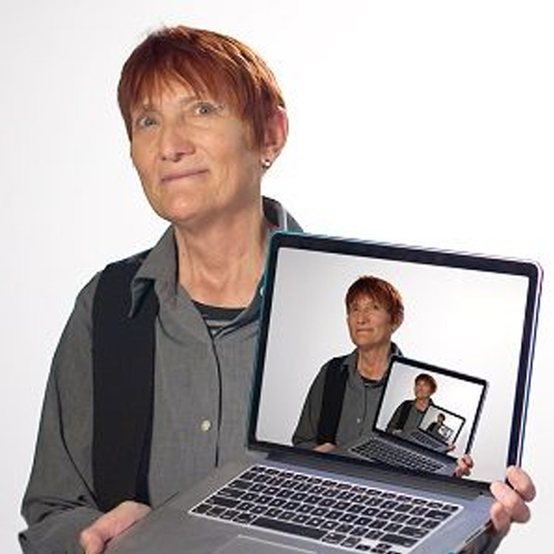 Deborah Fort holding laptop of infinitely recursive image of herself