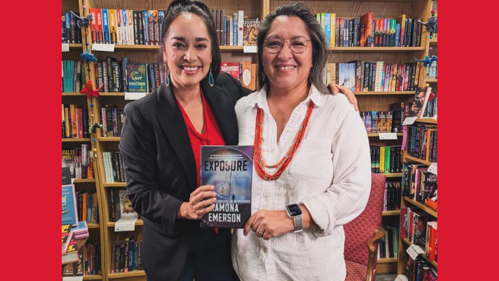 Ramona Emerson poses with book with news anchor