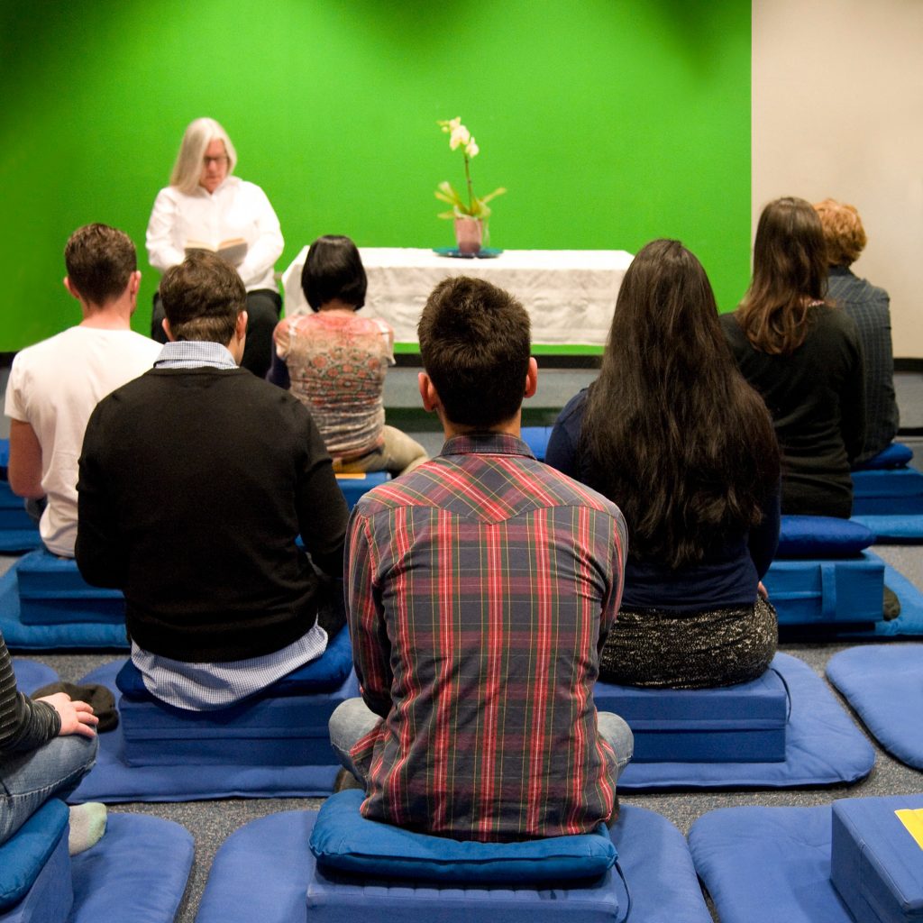 Susan Dever teaching a class in front of green screen